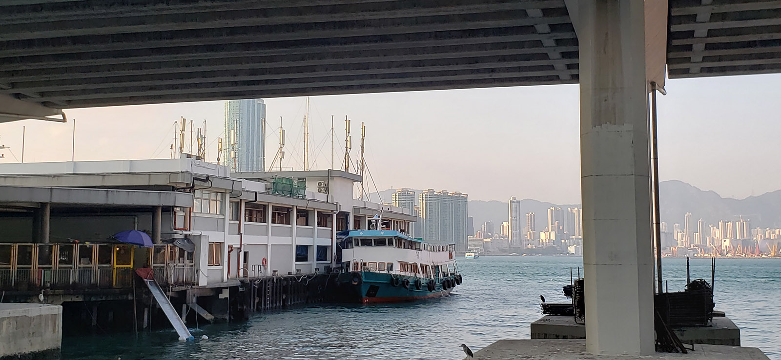 A nest of macrocells on the roof of the North Point Ferry Pier aimed in both directions along the Island Eastern Corridor in Hong Kong